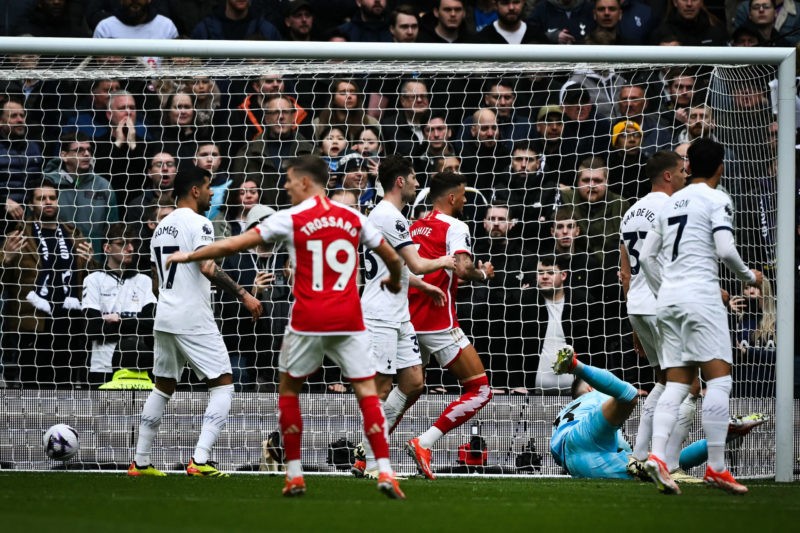 Tottenham Hotspur's Danish midfielder #05 Pierre-Emile Hojbjerg scores an own goal past Tottenham Hotspur's Italian goalkeeper #13 Guglielmo Vicario during the English Premier League football match between Tottenham Hotspur and Arsenal at the Tottenham Hotspur Stadium in London, on April 28, 2024. (Photo by BEN STANSALL/AFP via Getty Images)