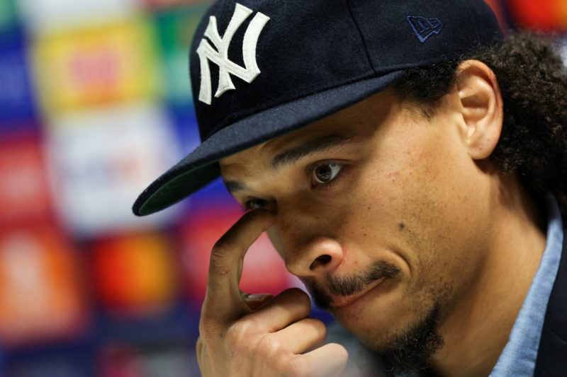 Bayern Munich's German midfielder Leroy Sane speaks during a press conference on the eve of their UEFA Champions League quarter final first leg foo...