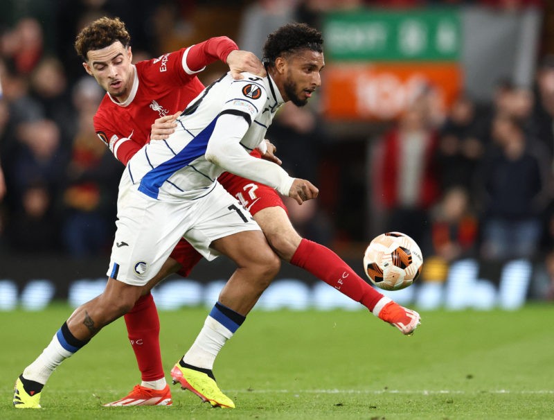 Liverpool's English midfielder #17 Curtis Jones (L) tackles Atalanta's Brazilian midfielder #13 Ederson Jose Dos Santos Lourenco da Silva during th...