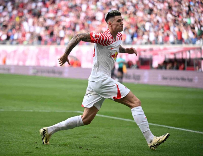 LEIPZIG, GERMANY - APRIL 13: Benjamin Sesko of Leipzig celebrates scoring his team's second goal during the Bundesliga match between RB Leipzig and...