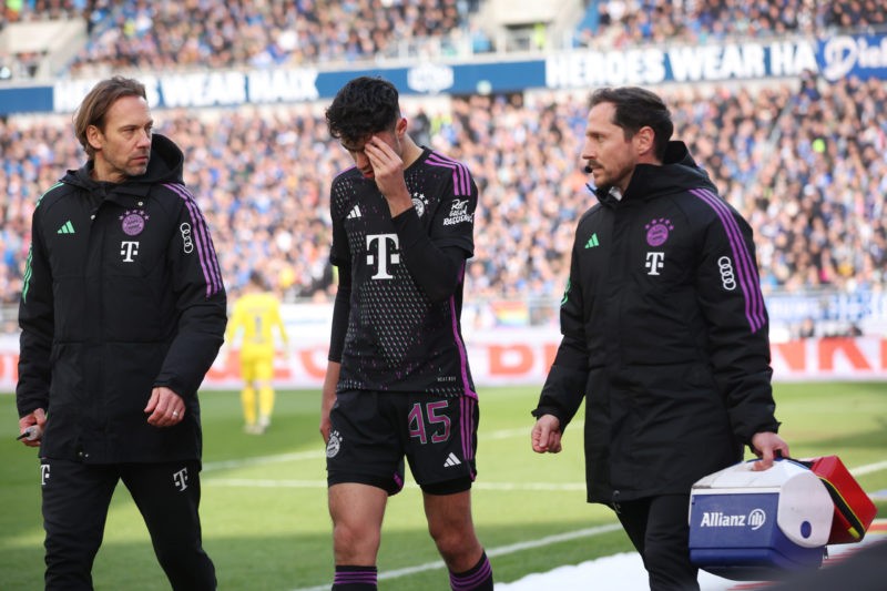 DARMSTADT, GERMANY - MARCH 16: Aleksandar Pavlovic of Bayern Munich holds an ice cube above his eye during the Bundesliga match between SV Darmstad...