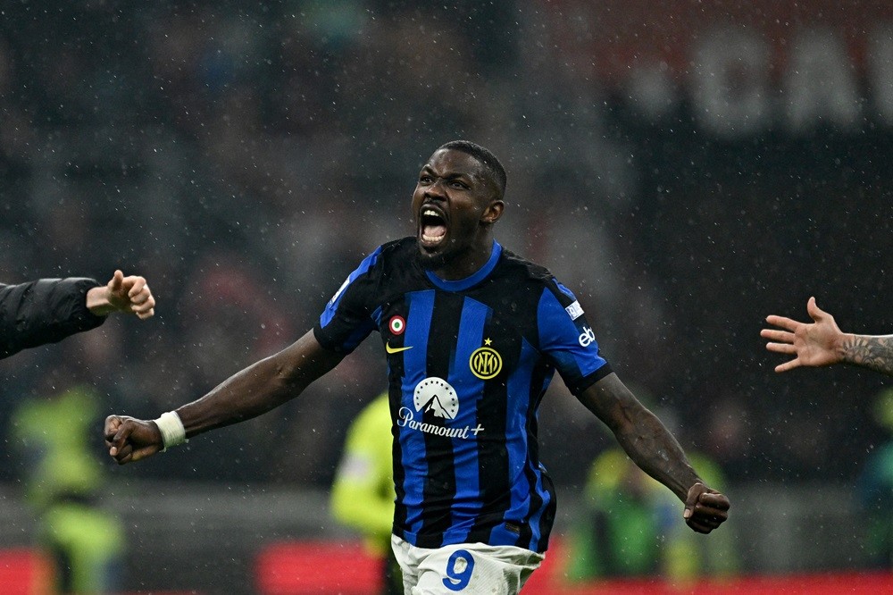 Inter Milan star thanks Arsenal legend after clinching Serie A title 4 Inter Milan's Marcus Thuram celebrates winning the 2024 Scudetto championship title on April 22, 2024, following the Italian Serie A football match between AC Milan and Inter Milan at the San Siro Stadium. (Photo by GABRIEL BOUYS/AFP via Getty Images)