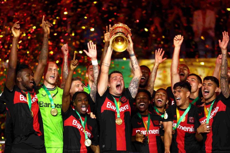 BERLIN, GERMANY - MAY 25: Granit Xhaka of Bayer 04 Leverkusen lifts the DFB-Pokal Trophy after his team's victory in the DFB Cup 2023/24 final matc...