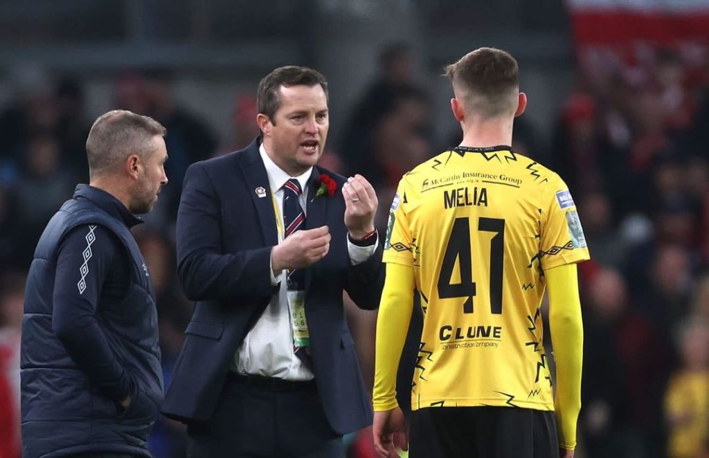 Mason Melia receiving instructions from a coach (Photo via Melia on Instagram)
