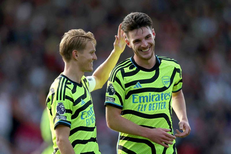 BOURNEMOUTH, ENGLAND - SEPTEMBER 30: Martin Oedegaard and Declan Rice of Arsenal celebrate during the Premier League match between AFC Bournemouth ...