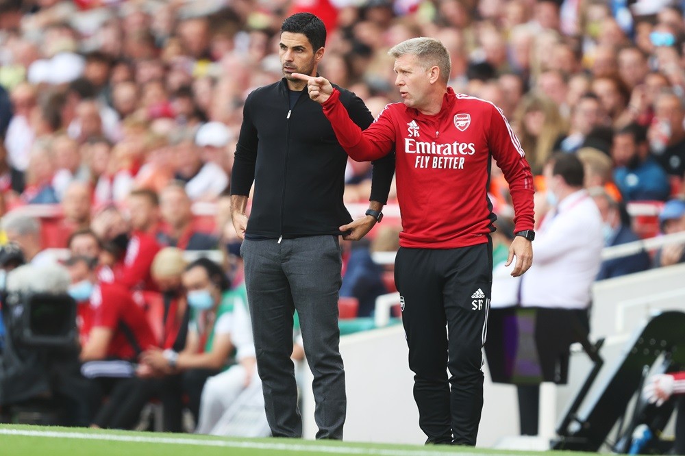 LONDON, ENGLAND: Mikel Arteta, Manager of Arsenal looks on as Steve Round, Assistant Manager gives instructions during the Premier League match bet...