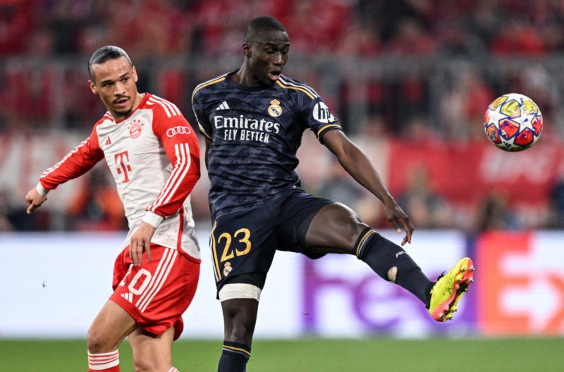 Bayern Munich's German forward #10 Leroy Sane and Real Madrid's French defender #23 Ferland Mendy vie for the ball during the UEFA Champions League semi-final first leg football match between FC Bayern Munich and Real Madrid CF on April 30, 2024 in Munich, southern Germany. (Photo by KIRILL KUDRYAVTSEV/AFP via Getty Images)