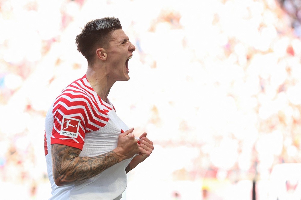 Leipzig's Benjamin Sesko celebrates scoring during the German first division Bundesliga football match between RB Leipzig and Werder Bremen in Leipzig, eastern Germany on May 11, 2024. (Photo by RONNY HARTMANN/AFP via Getty Images)