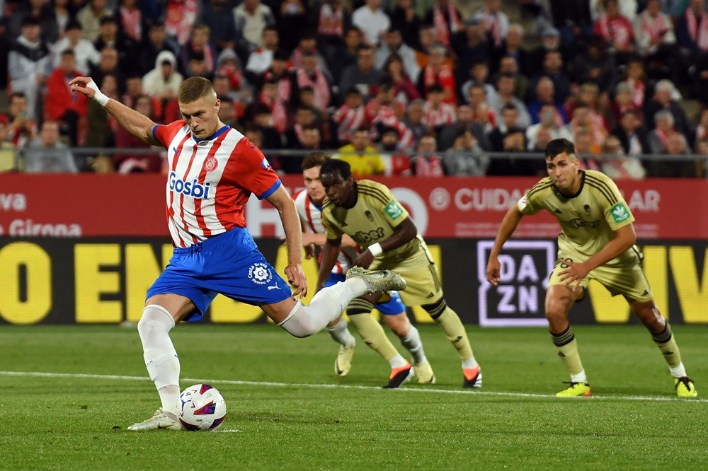 Girona's Artem Dovbyk shoots a penalty kick and scores his team's third goal during the Spanish league football match between Girona FC and Granada FC at the Montilivi stadium in Girona on May 24, 2024. (Photo by MANAURE QUINTERO/AFP via Getty Images)