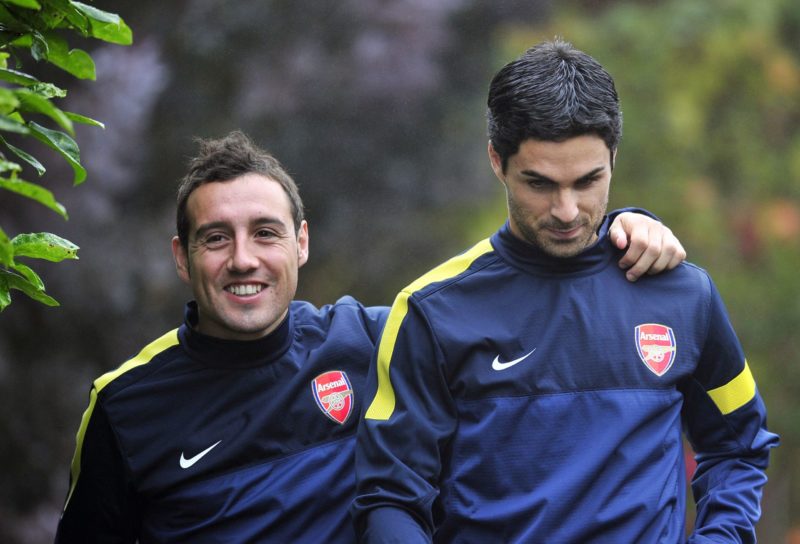 Arsenal's Spanish midfielder Santi Cazorla (L) and Spanish midfielder Mikel Arteta (R) attend training for the forthcoming UEFA Champions League gr...