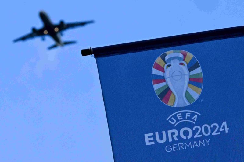 A flag with the logo of the UEFA Euro 2024 European Football Championship is pictured outside the Arena Frankfurt football stadium in Frankfurt am ...