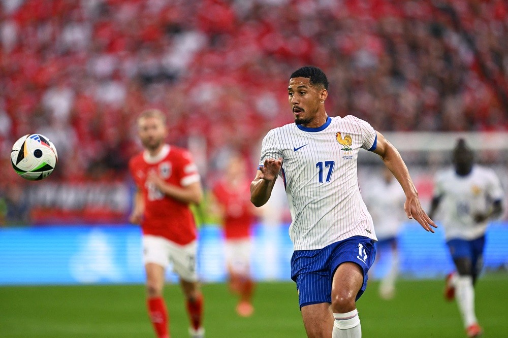 France's William Saliba eyes the ball during the UEFA Euro 2024 Group D football match between Austria and France at the Duesseldorf Arena in Duess...