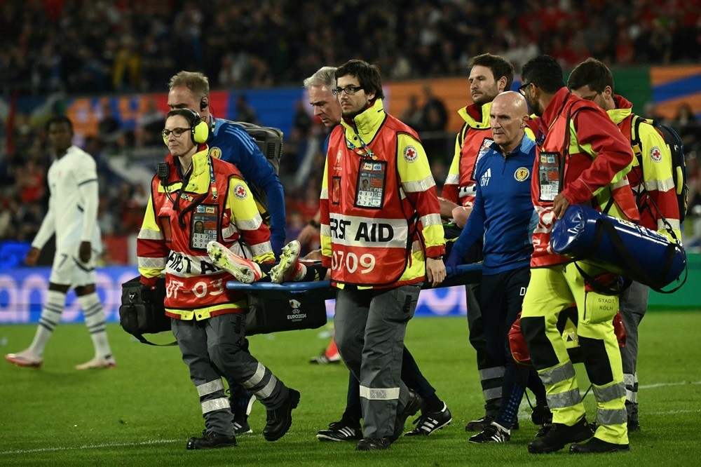 Arsenal man's Euros over as he's sent back to London 4 Scotland's Kieran Tierney leaves the game on a stretcher, injured during the UEFA Euro 2024 Group A football match between Scotland and Switzerland at the Cologne Stadium in Cologne on June 19, 2024. (Photo by ANGELOS TZORTZINIS/AFP via Getty Images)