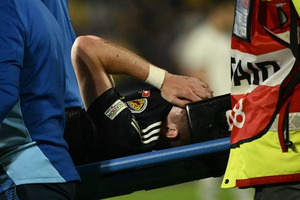 Scotland's Kieran Tierney reacts on a stretcher as he leaves the game injured during the UEFA Euro 2024 Group A football match between Scotland and...