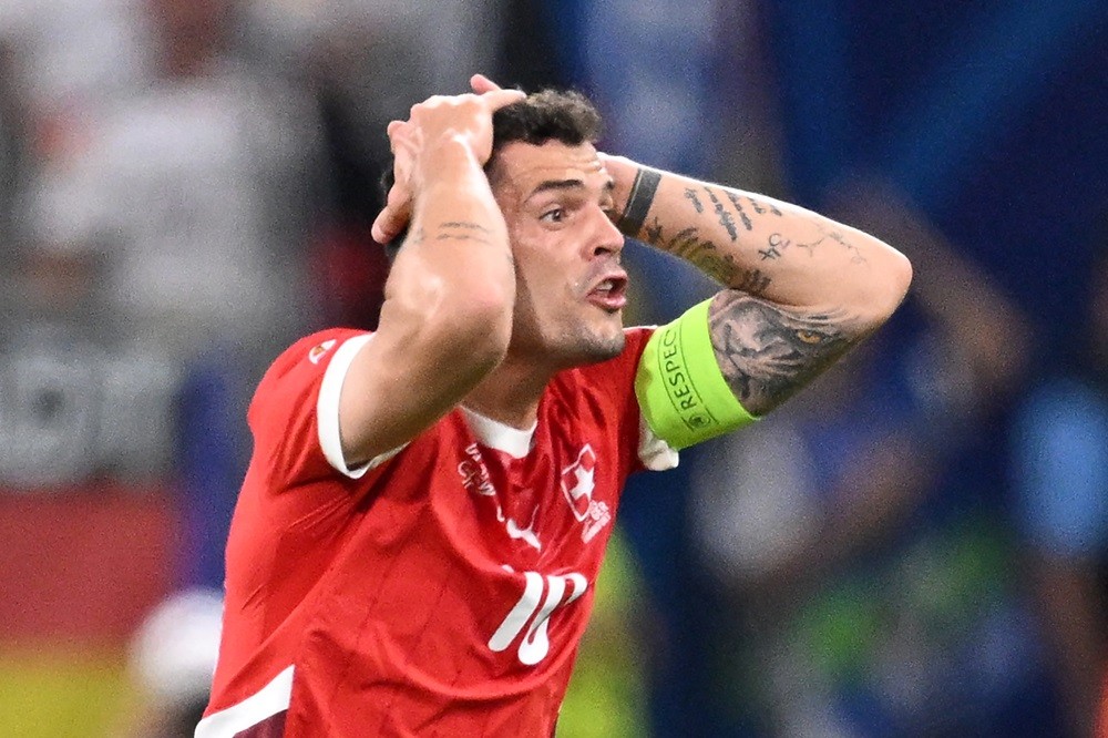 Switzerland's Granit Xhaka reacts during the UEFA Euro 2024 Group A football match between Switzerland and Germany at the Frankfurt Arena in Frankf...