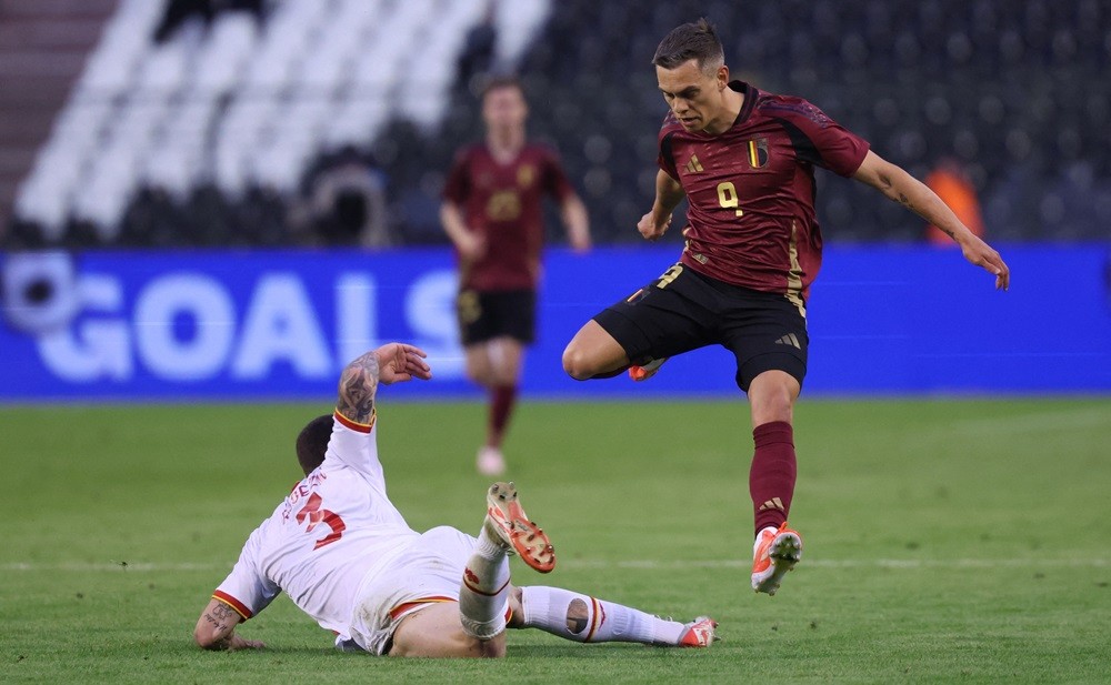 Montenegro's Slobodan Rubezic and Belgium's Leandro Trossard fight for the ball during a friendly match between Belgian national team Red Devils and the national team of Montenegro, at the King Baudouin Stadium in Brussels, Wednesday 05 June 2024. (Photo by VIRGINIE LEFOUR/BELGA MAG/AFP via Getty Images)