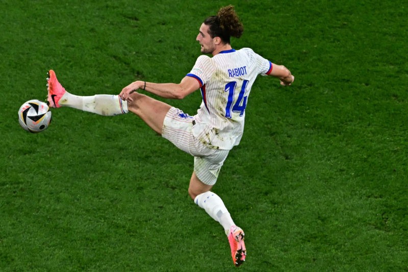 TOPSHOT - France's midfielder #14 Adrien Rabiot kicks the ball during the UEFA Euro 2024 semi-final football match between Spain and France at the ...