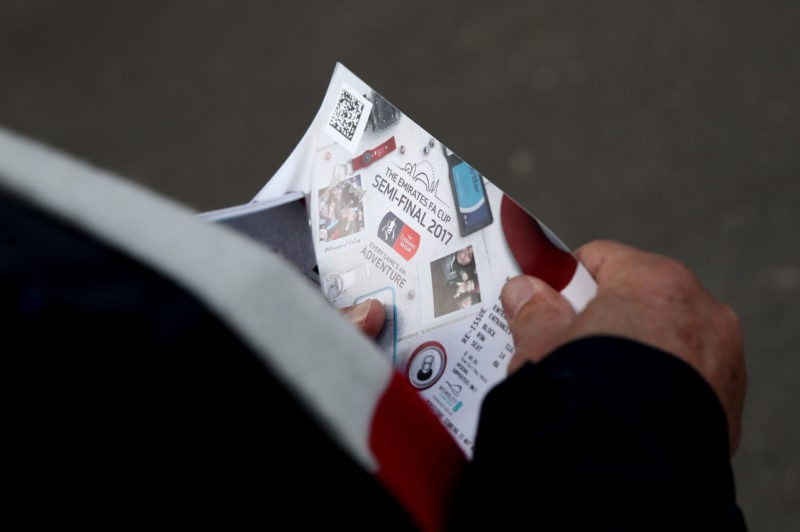 LONDON, ENGLAND - APRIL 23: A fan holds a ticket prior to the Emirates FA Cup Semi-Final match between Arsenal and Manchester City at Wembley Stadi...