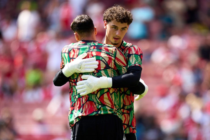 LONDON, ENGLAND - AUGUST 11: David Raya of Arsenal embraces his teammate Tommy Setford prior to the pre-season friendly match between Arsenal and O...