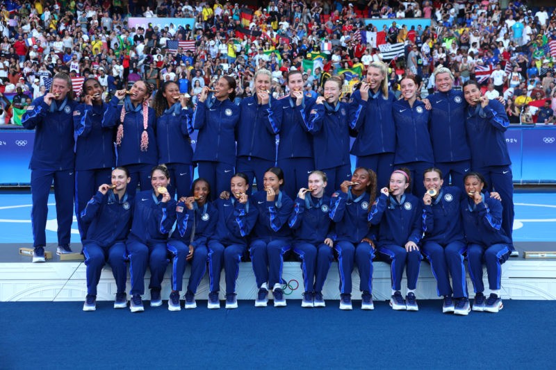 PARIS, FRANCE - AUGUST 10: Gold Medalists of Team United States pose for a photo after the Women's Football Medal Ceremony during the Olympic Games...