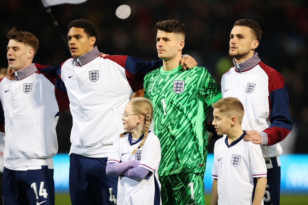 BOLTON, ENGLAND: Players of England line up for the national anthem prior to the UEFA U21 Euro 2025 Qualifier between England and Luxembourg at Tou...