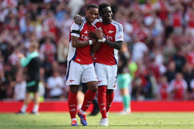 Arsenal's Dutch defender #12 Jurrien Timber (L) and Arsenal's English midfielder #07 Bukayo Saka (R) celebrate their win on the pitch after the Eng...