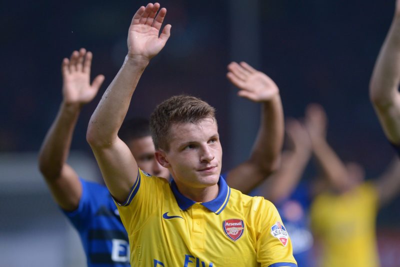 This picture taken on July 14, 2013 shows Arsenal's Thomas Eisfeld waving to supporters after a friendly football match against Indonesia's Dream T...