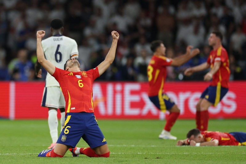 Spain's midfielder #06 Mikel Merino celebrates after winning the UEFA Euro 2024 final football match between Spain and England at the Olympiastadio...