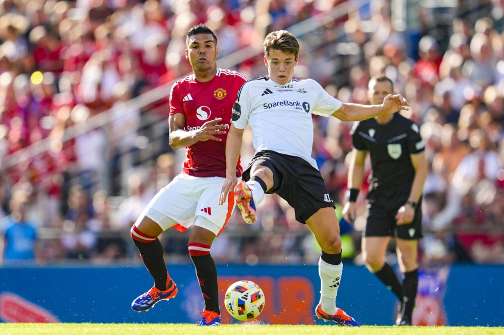 Manchester United's Casemiro (L) and Rosenborg's Sverre Nypan vie for the ball during the friendly football match between Rosenborg BK and Manchest...