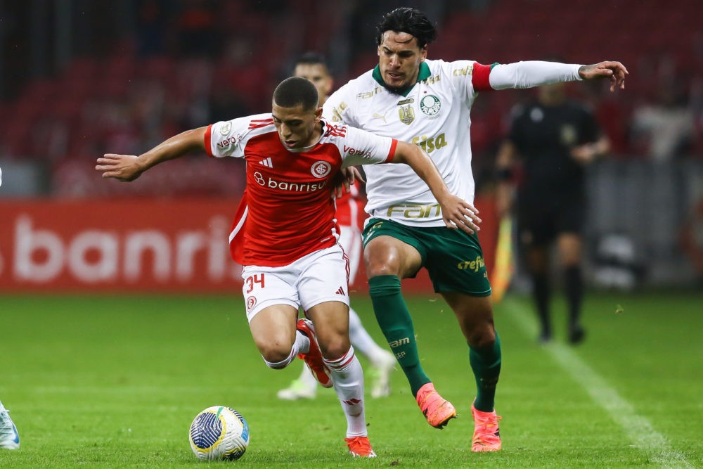 PORTO ALEGRE, BRAZIL: Gabriel Carvalho of Internacional and Raphael Veiga of Palmeiras compete for the ball during the match between Internacional ...