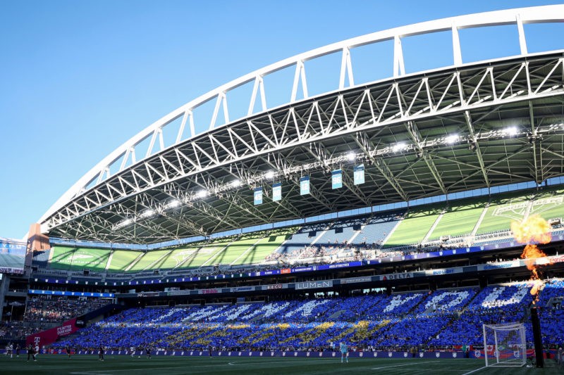 SEATTLE, WASHINGTON - OCTOBER 06: Fans hold signs that read "Thank You Megan" to honor Megan Rapinoe #15 of OL Reign during her last home regular-s...