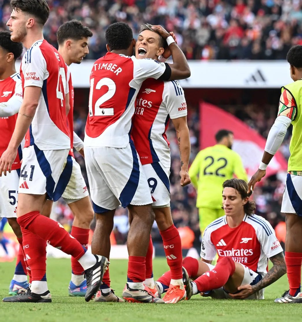 Riccardo Calafiori (R) sits on the ground after appearing to suffer an injury during Arsenal's goal celebrations (Photo via @afcstuff on Twitter)