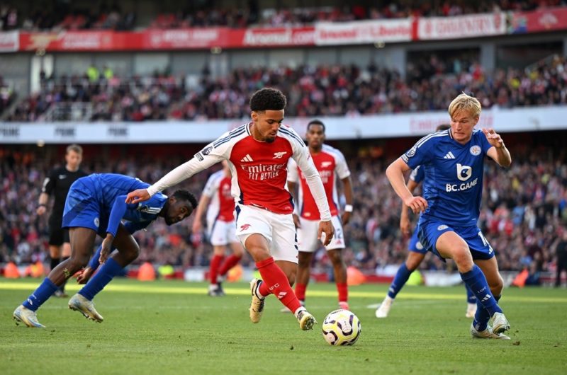 Leandro Trossard buzzing but relieved after dramatic Arsenal win 4 LONDON, ENGLAND: Ethan Nwaneri of Arsenal rtakes on Victor Kristiansen of Leicester City during the Premier League match between Arsenal FC and Leicester City FC at Emirates Stadium on September 28, 2024. (Photo by Shaun Botterill/Getty Images)