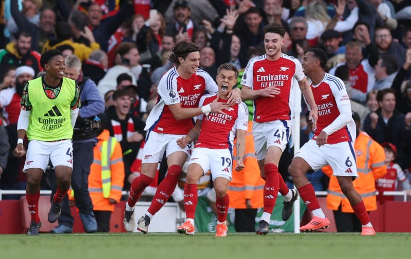 LONDON, ENGLAND - SEPTEMBER 28: Leandro Trossard of Arsenal celebrates with teammate Riccardo Calafiori after scoring his team's third goal during ...