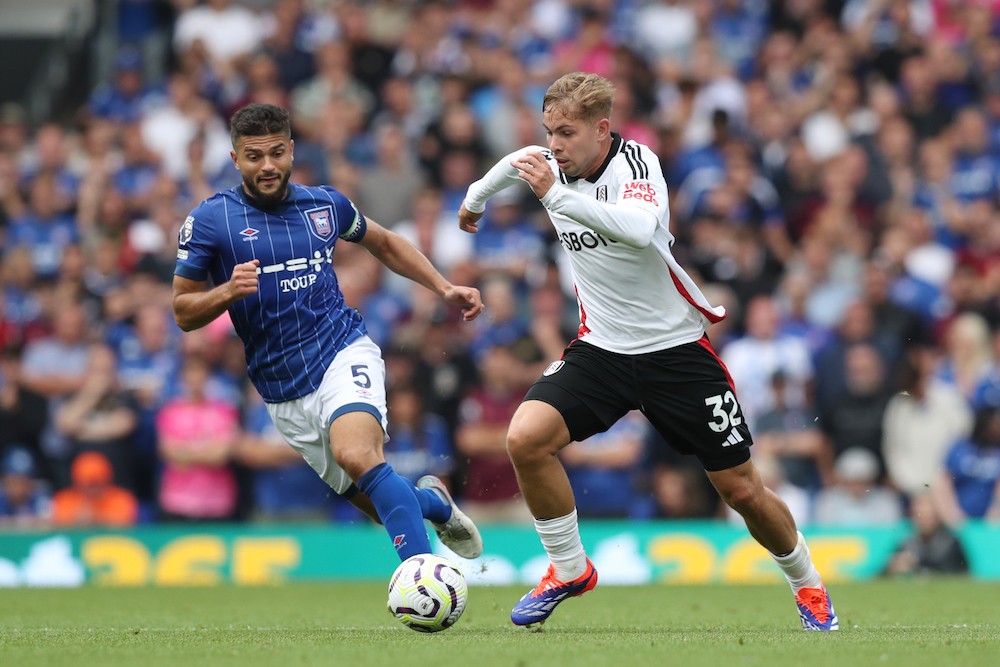 IPSWICH, ENGLAND: Emile Smith Rowe of Fulham runs with the ball whilst under pressure from Sam Morsy of Ipswich Town during the Premier League matc...