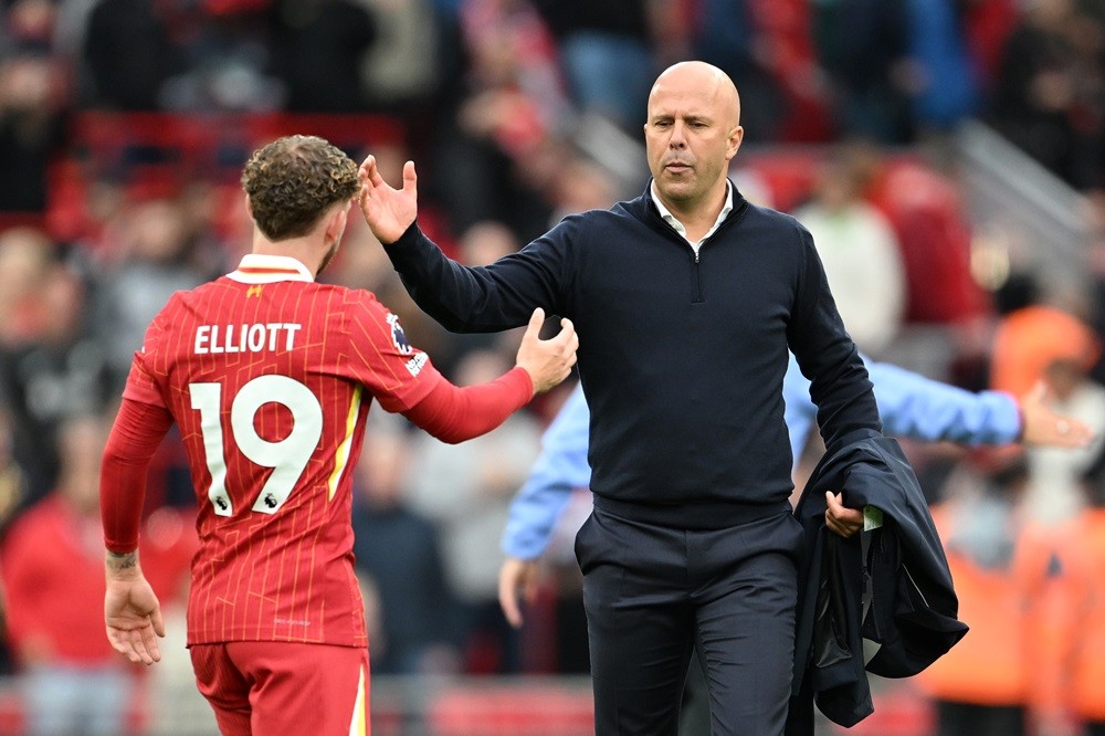 LIVERPOOL, ENGLAND: Arne Slot, Manager of Liverpool, interacts with Harvey Elliott of Liverpool after the Premier League match between Liverpool FC...