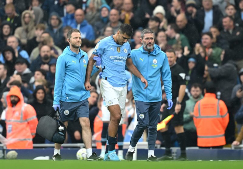 MANCHESTER, ENGLAND - SEPTEMBER 22: Rodri of Manchester City leaves the pitch following an injury during the Premier League match between Mancheste...