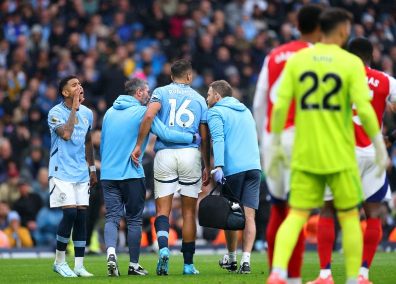 MANCHESTER, ENGLAND - SEPTEMBER 22: Rodri of Manchester City leaves the pitch following an injury during the Premier League match between Mancheste...