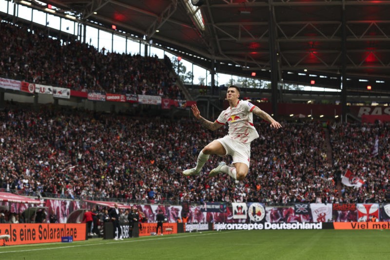 LEIPZIG, GERMANY - SEPTEMBER 28: Benjamin Sesko of RB Leipzig celebrates after scoring the team's first goal during the Bundesliga match between RB...