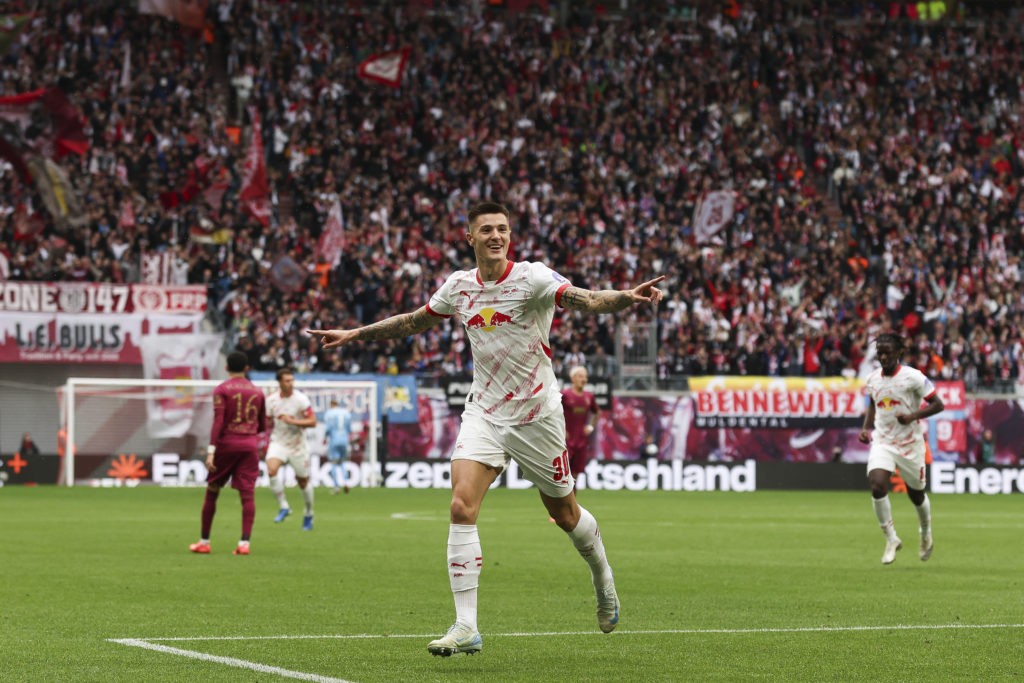 LEIPZIG, GERMANY - SEPTEMBER 28: Benjamin Sesko of RB Leipzig celebrates after scoring the team's first goal during the Bundesliga match between RB Leipzig and FC Augsburg at Red Bull Arena on September 28, 2024 in Leipzig, Germany. (Photo by Maja Hitij/Getty Images)