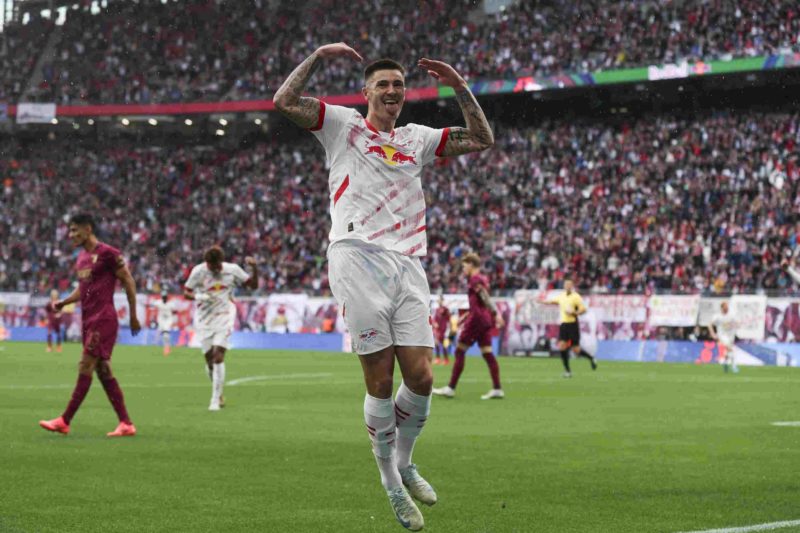 LEIPZIG, GERMANY - SEPTEMBER 28: Benjamin Sesko of RB Leipzig celebrates after scoring the team's second goal during the Bundesliga match between R...