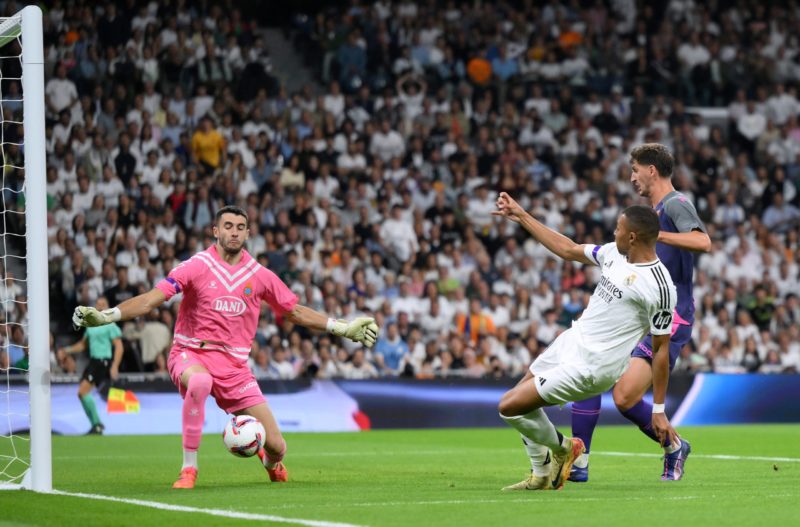 MADRID, SPAIN - SEPTEMBER 21: Joan Garcia of RCD Espanyol saves a shot from Kylian Mbappe of Real Madrid during the LaLiga match between Real Madri...