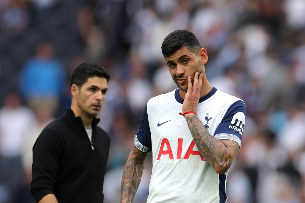 LONDON, ENGLAND: Christian Romero of Tottenham Hotspur reacts ahead of Mikel Arteta, Manager of Arsenal during the Premier League match between Tot...