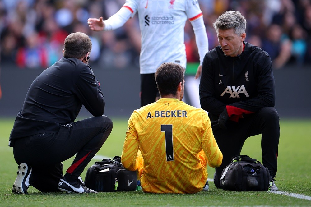 LONDON, ENGLAND: Alisson Becker of Liverpool receives treatment before going off injured during the Premier League match between Crystal Palace FC ...