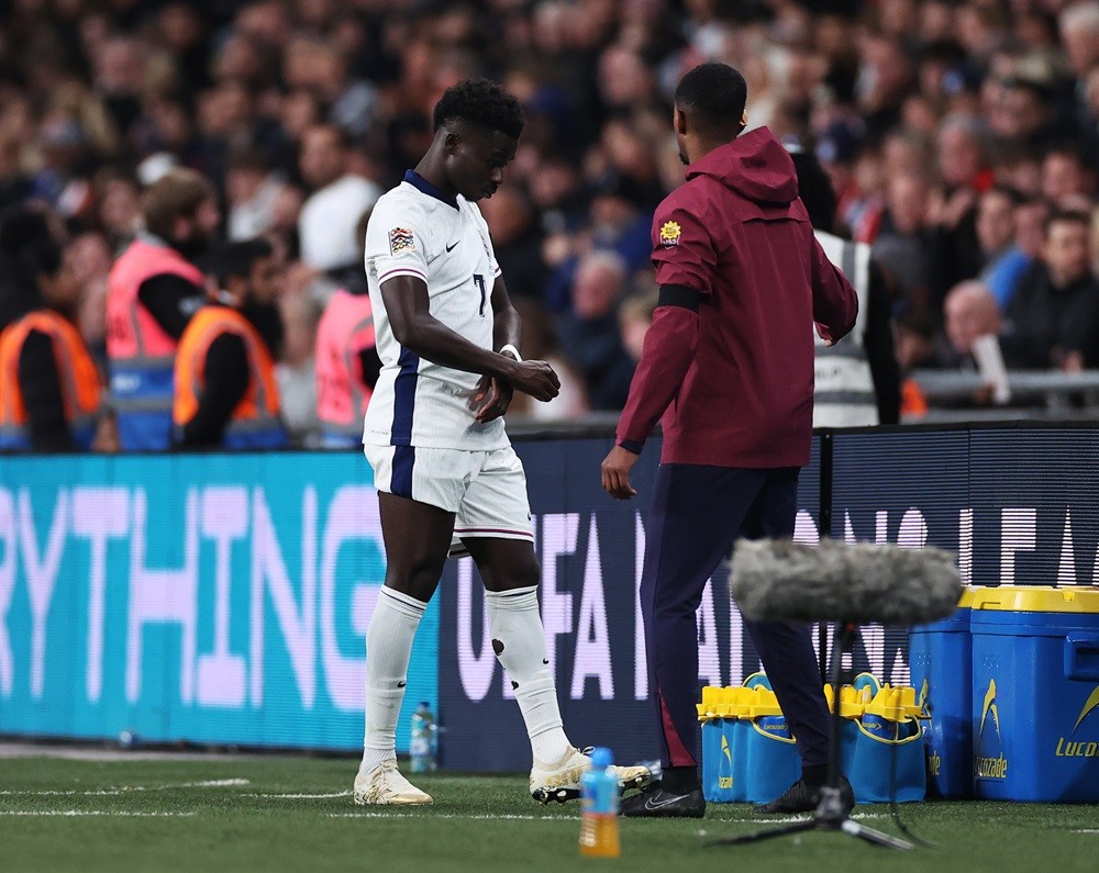 LONDON, ENGLAND: Bukayo Saka of England reacts as he leaves the field to be substituted after receiving medical treatment to an injury during the U...