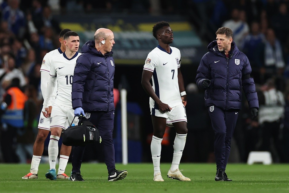 LONDON, ENGLAND: Bukayo Saka of England reacts as he leaves the field to be substituted after receiving medical treatment to an injury during the U...