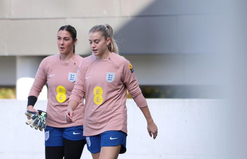 BURTON-UPON-TRENT, ENGLAND - OCTOBER 22: Mary Earps and Alessia Russo of England walk out ahead of a training session at St Georges Park on October 22, 2024 in Burton-upon-Trent, England. (Photo by Morgan Harlow/Getty Images)