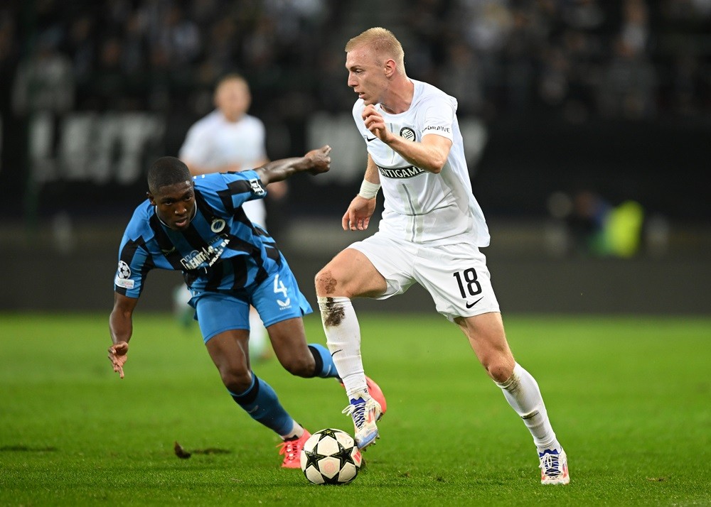 GRAZ, AUSTRIA: Mika Biereth of SK Sturm Graz runs with the ball under pressure from Joel Ordonez of Club Brugge KV during the UEFA Champions League...