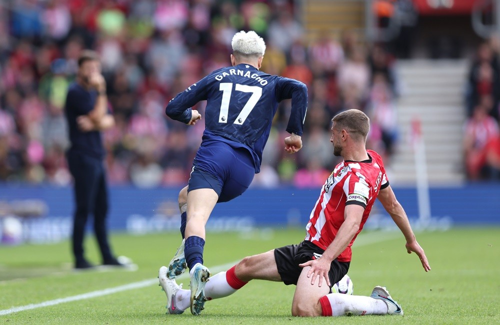 SOUTHAMPTON, ENGLAND: Jack Stephens of Southampton fouls Alejandro Garnacho of Manchester United leading to a red card during the Premier League ma...