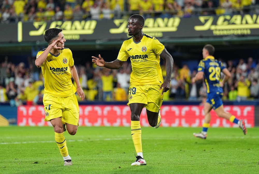 VILLARREAL, SPAIN: Nicolas Pepe of Villarreal CF celebrates scoring his team's first goal with teammate Ilias Akhomach during the LaLiga match betw...